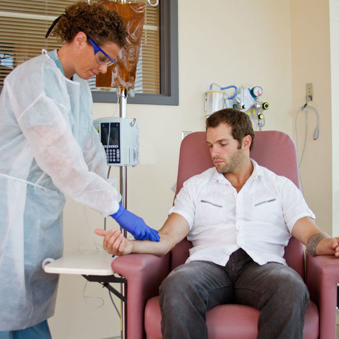 Nurse attaching intravenous for patient chemotherapy